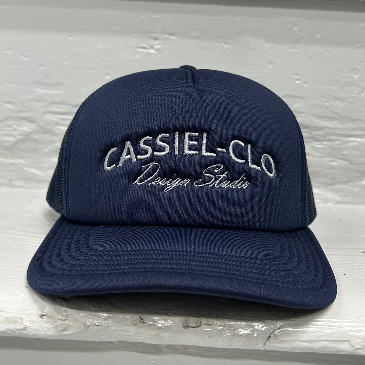Cassiel Clo Arch Logo Navy Foam Trucker Cap